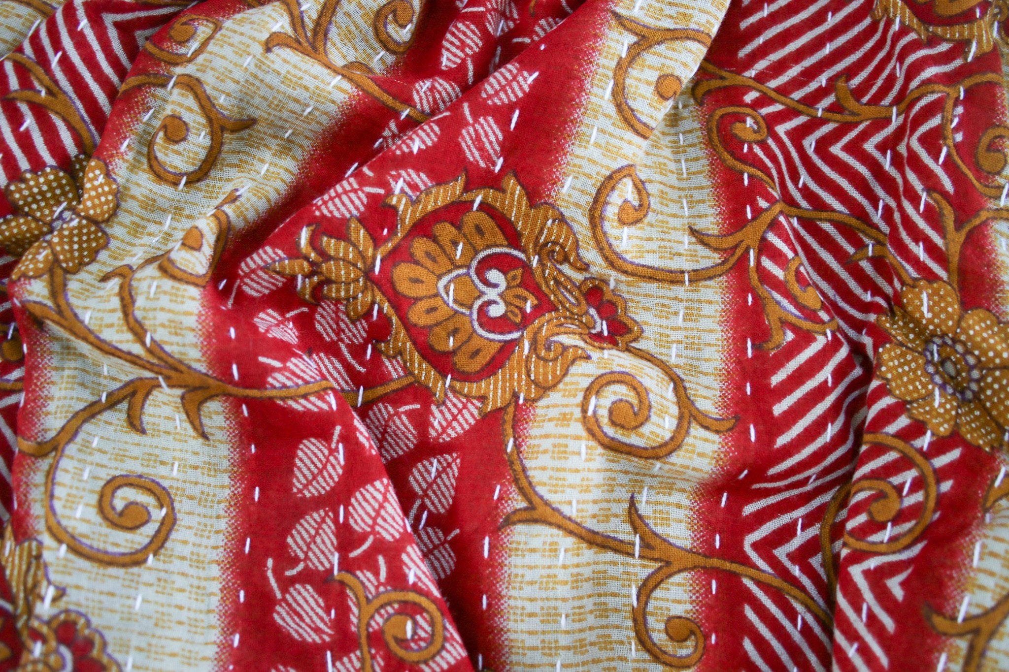 Close-up of red and gold patterned fabric