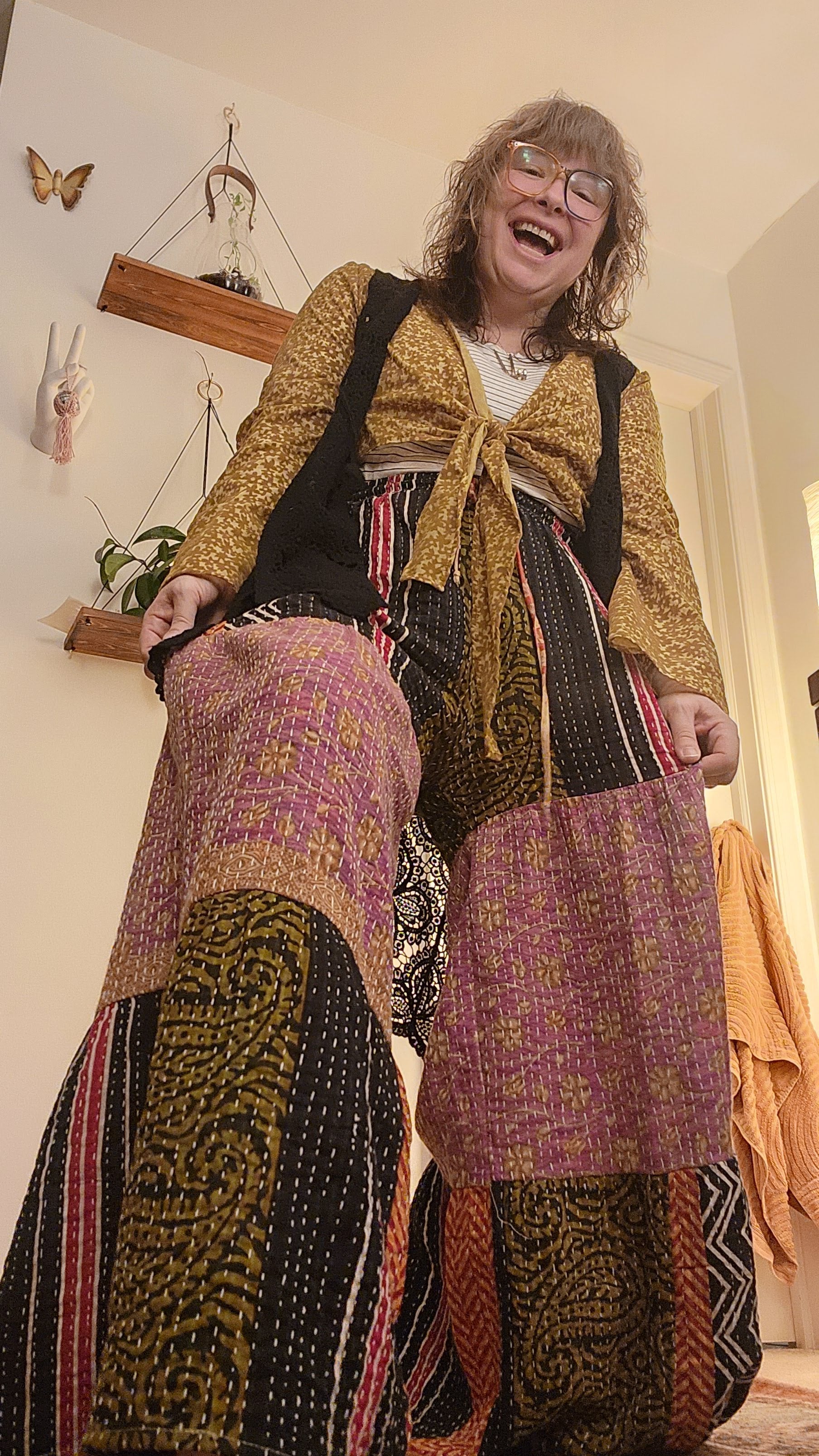 Person wearing a colorful, patterned garment in an indoor setting